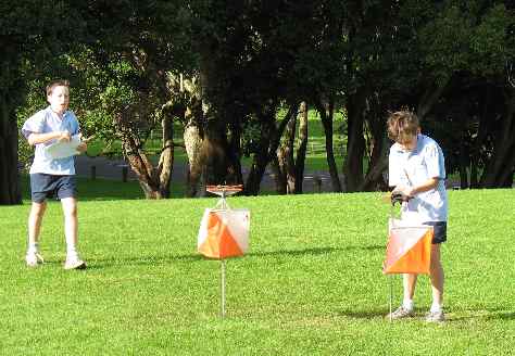 Student Punching Orienteering Control