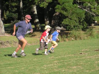 Family running
          across field